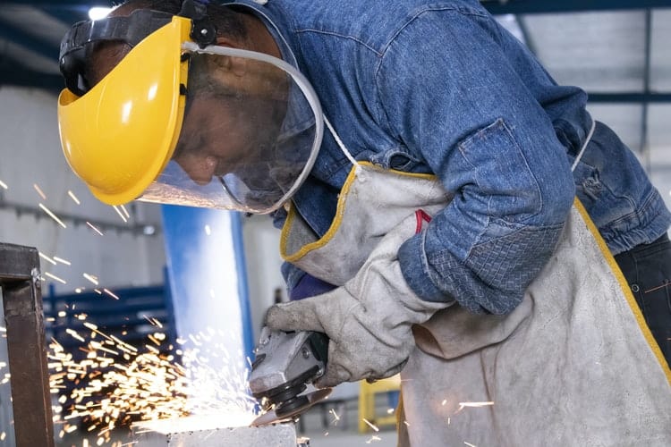 a welder with a welding shield